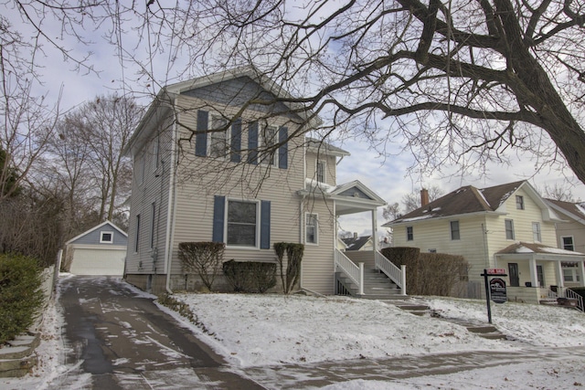 view of front of house featuring a garage and an outdoor structure