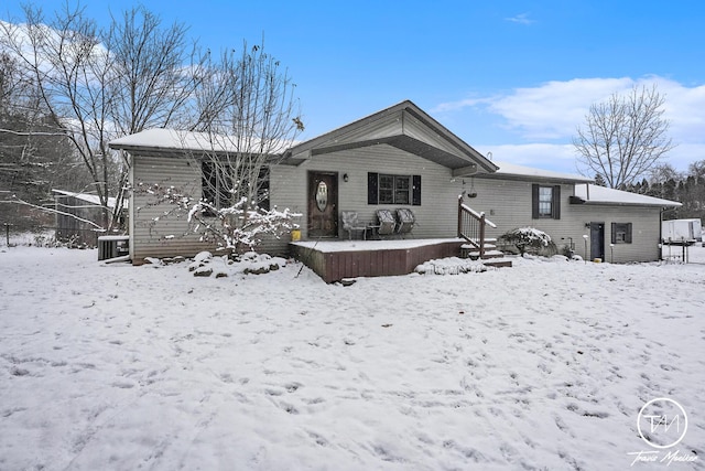 view of snow covered house