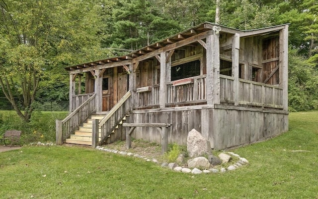 view of outbuilding with a yard