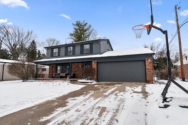 view of front property with covered porch and a garage