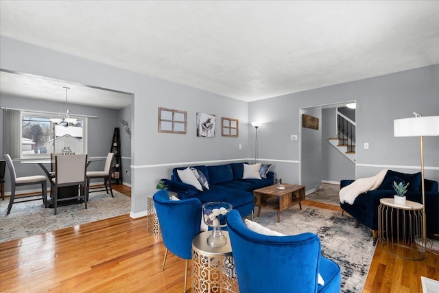 living room featuring a chandelier and hardwood / wood-style flooring