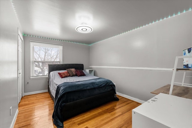 bedroom with wood-type flooring