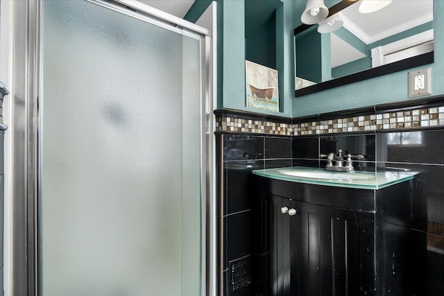 bathroom featuring backsplash, ornamental molding, a shower with shower door, and vanity