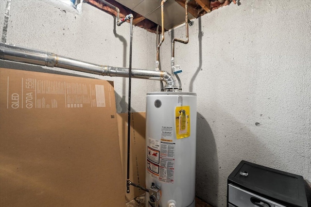 utility room with water heater