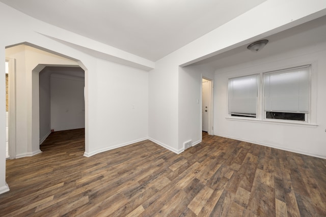 unfurnished room with dark hardwood / wood-style floors