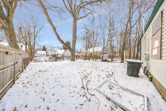 view of yard layered in snow