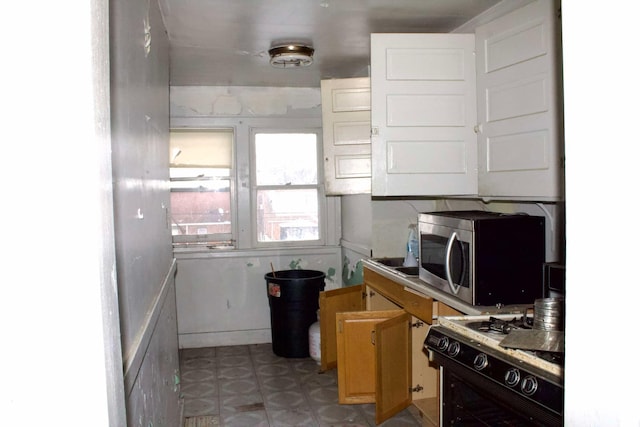 kitchen with white gas range