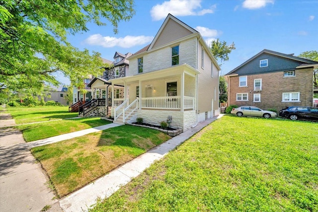 view of front of property featuring covered porch and a front yard