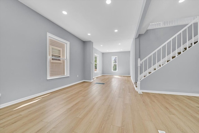 unfurnished living room with light hardwood / wood-style floors