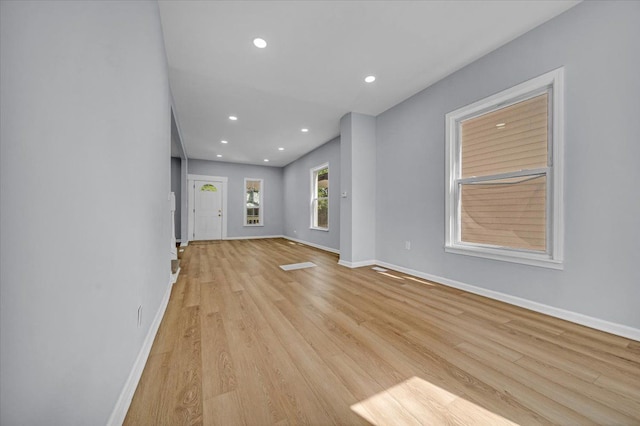 unfurnished living room with light hardwood / wood-style flooring