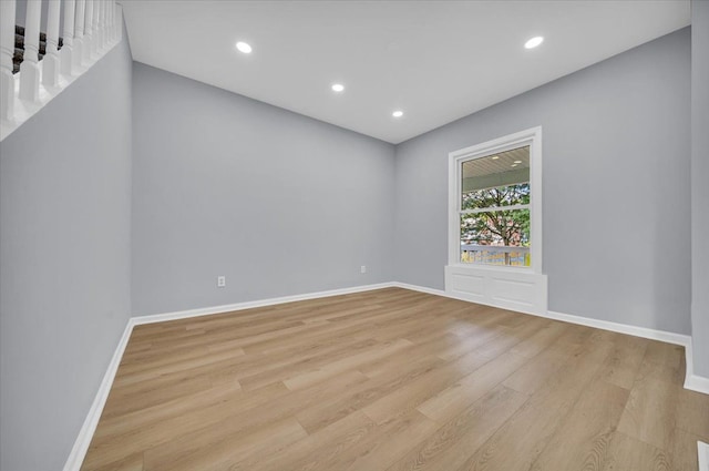 spare room with light wood-type flooring