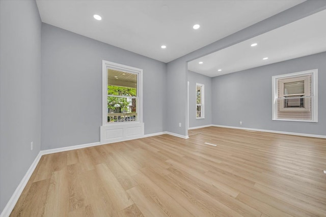 unfurnished room with light hardwood / wood-style floors