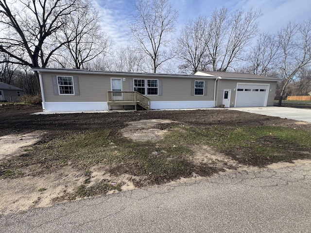 manufactured / mobile home featuring a garage