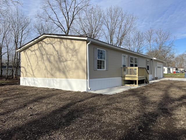 view of side of property featuring a garage