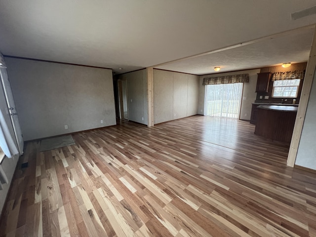 unfurnished living room featuring light hardwood / wood-style flooring