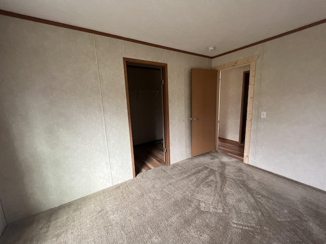 empty room with light colored carpet and ornamental molding