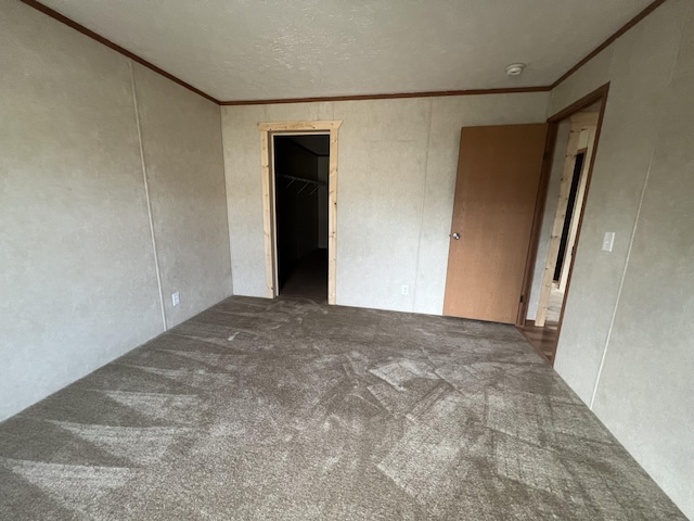 carpeted spare room with crown molding