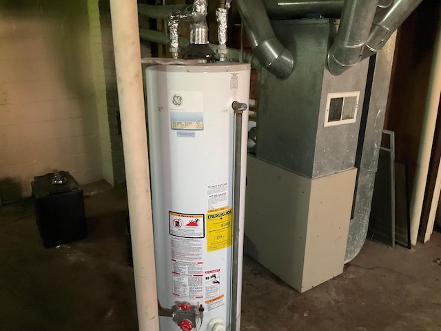 utility room with heating unit and water heater