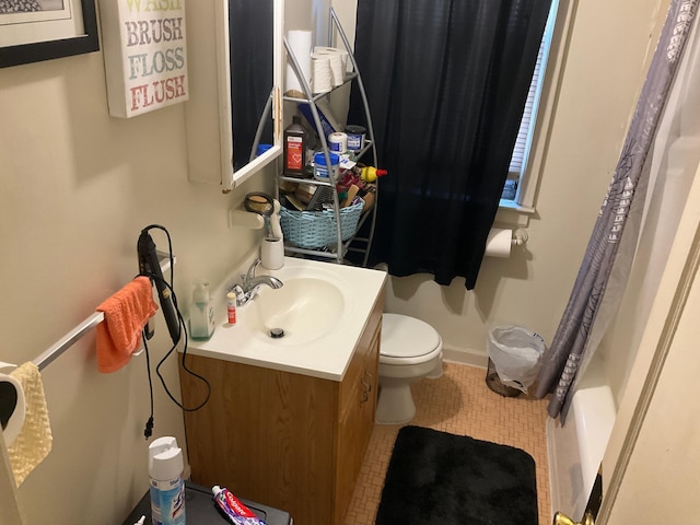 bathroom with tile patterned floors, vanity, a shower with shower curtain, and toilet