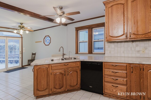 kitchen featuring tasteful backsplash, dishwasher, crown molding, and a sink