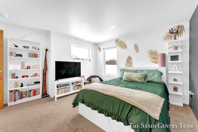 carpeted bedroom with a textured ceiling