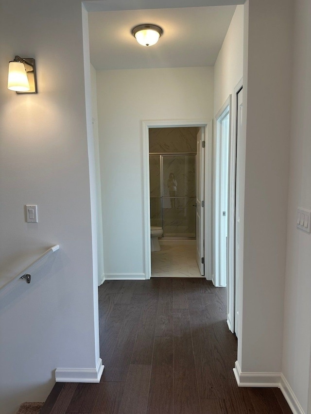 corridor featuring dark hardwood / wood-style floors