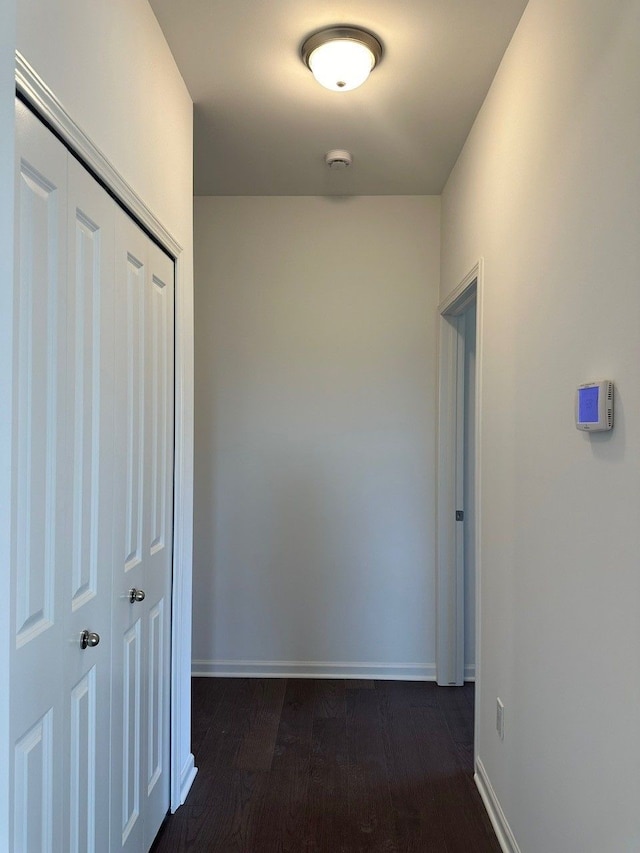 corridor with dark wood-type flooring