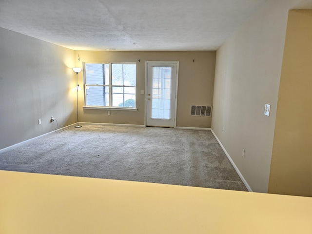 spare room with carpet flooring