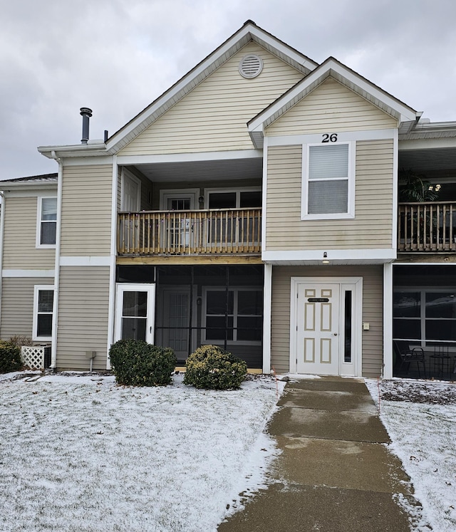 view of front of house featuring a balcony