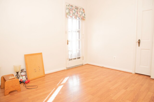 empty room featuring hardwood / wood-style flooring