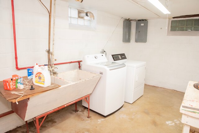 washroom with washing machine and dryer and electric panel