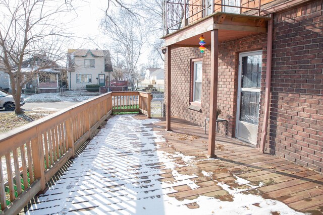 view of snow covered deck