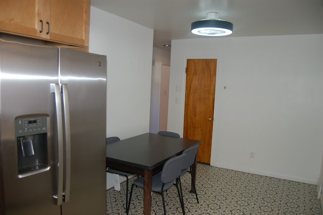 dining area featuring baseboards