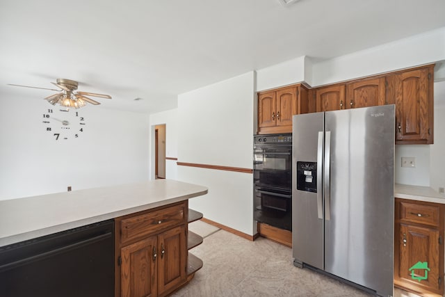 kitchen with ceiling fan and black appliances