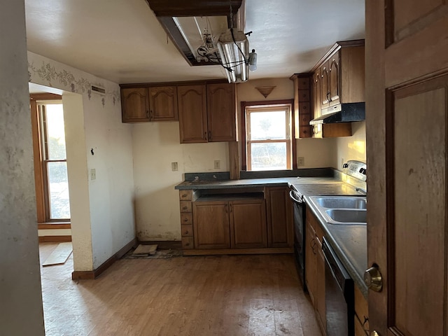 kitchen featuring black appliances and light wood-type flooring