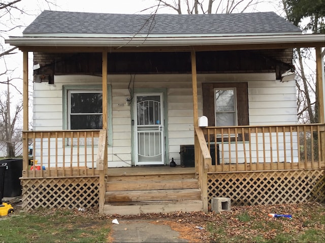 doorway to property featuring covered porch