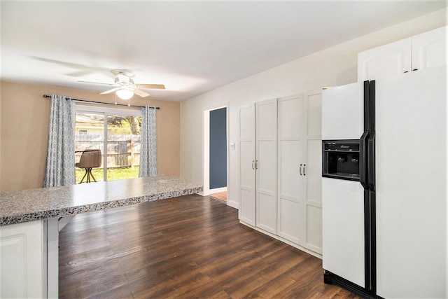 kitchen with dark hardwood / wood-style floors, white fridge with ice dispenser, white cabinetry, and ceiling fan