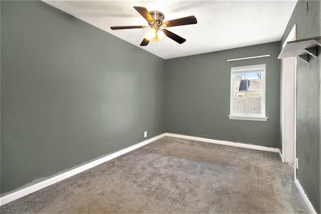 unfurnished room featuring ceiling fan and carpet floors