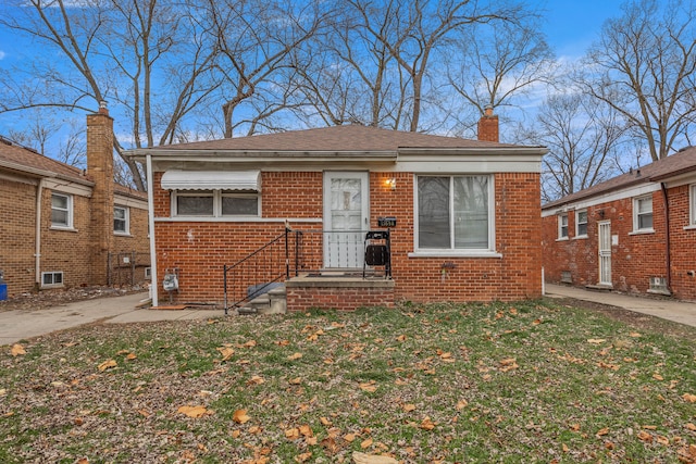 bungalow with a front lawn