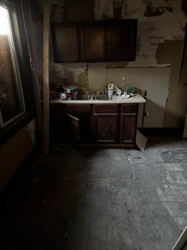 kitchen with dark brown cabinetry and sink