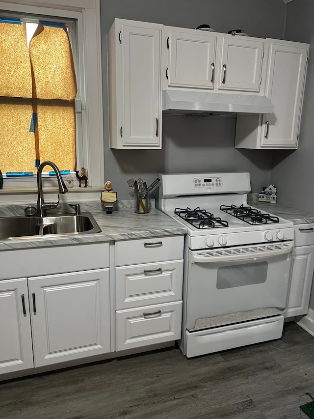 kitchen with white cabinetry, gas range gas stove, sink, and dark wood-type flooring