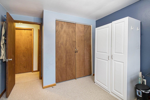 carpeted bedroom with a closet