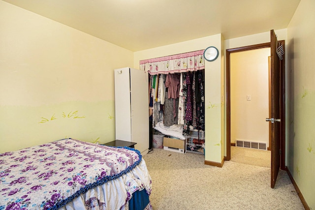 carpeted bedroom featuring a closet