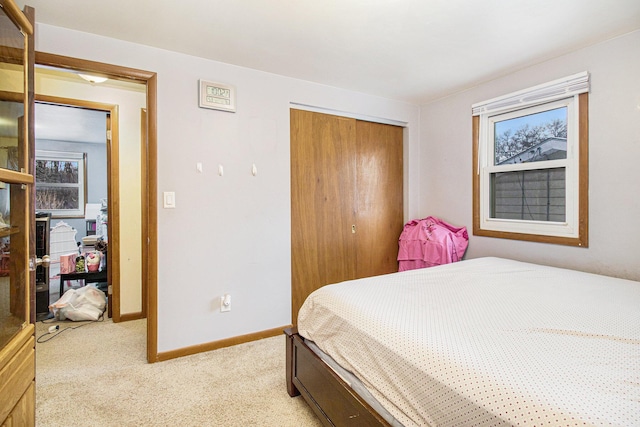 carpeted bedroom featuring a closet