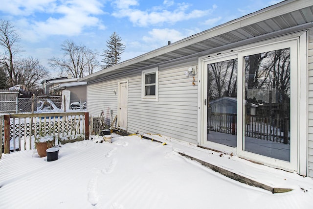 view of snow covered deck