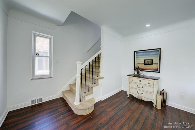 stairs with hardwood / wood-style flooring