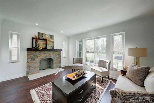 13966 Warwick St, Detroit, MI 48223 - living area with dark wood-style floors, a fireplace, and recessed lighting