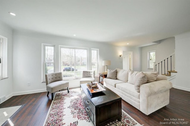 living room featuring dark wood-type flooring