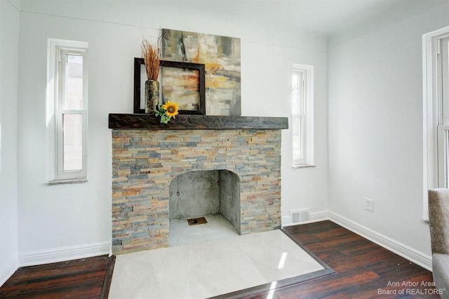 13966 Warwick St, Detroit, MI 48223 - detailed view of wood finished floors and a fireplace