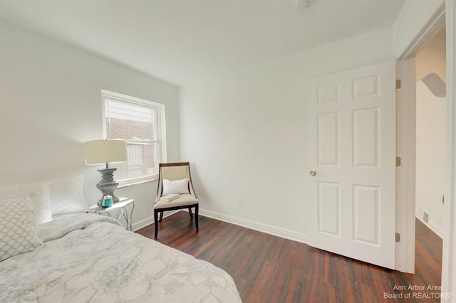 bedroom featuring dark hardwood / wood-style flooring